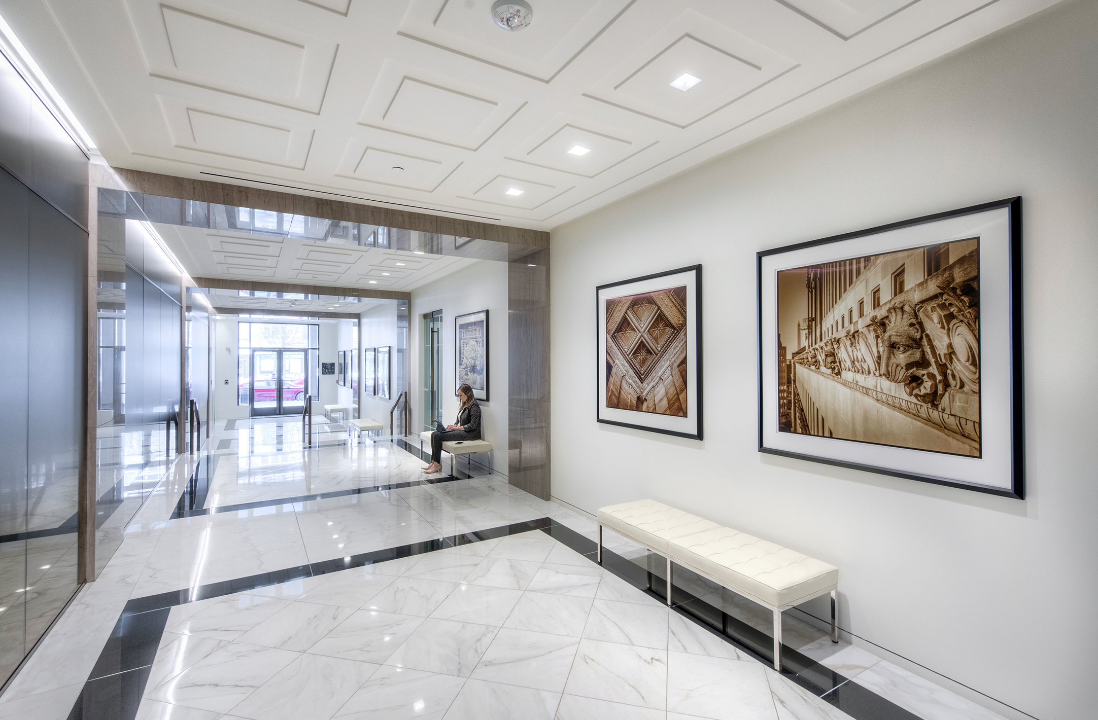 Image of K Street entrance to the 1500 K Street luxury office building, including artwork and gym access.