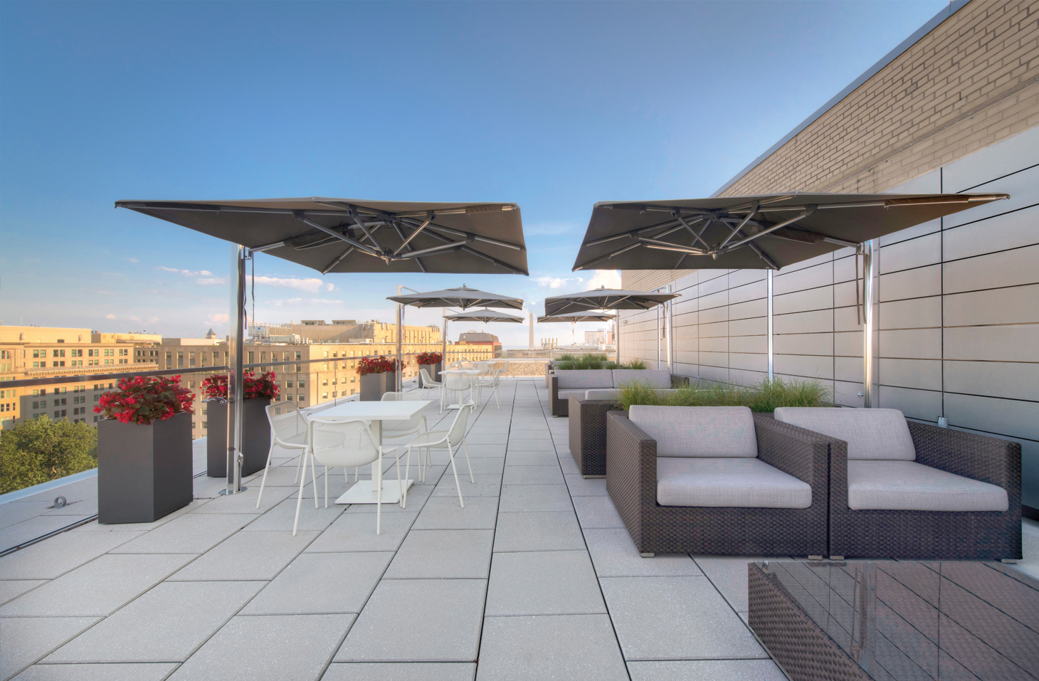 Image of the 1500 K Street rooftop terrace, with outdoor furniture, umbrellas and striking views.