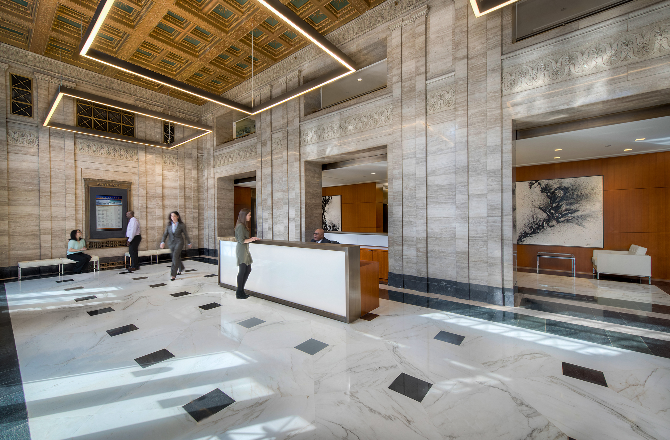 Image of the main lobby of the 1500 K Street DC office building, including restored ceiling and marble finishes