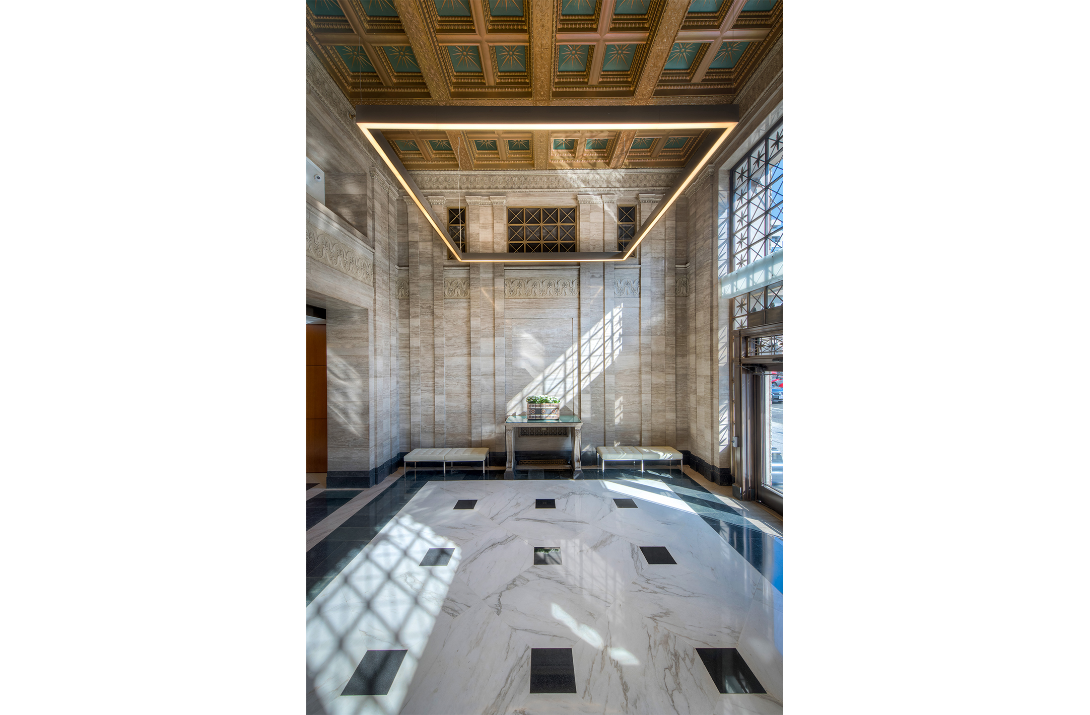 Image of the 1500 K Street office building lobby with a focus on coffered ceiling and LED lighting installations